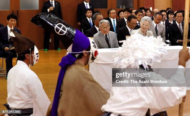 Emperor Akihito and Empress Michiko watch a traditional dance during their visit to Yoronjima Island on November 17, 2017 in Yoron, Kagoshima, Japan.