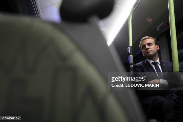 France's President Emmanuel Macron travels by bus to visit the Volvo Campus Lundby of the Swedish carmaker on the sidelines of the European Social...