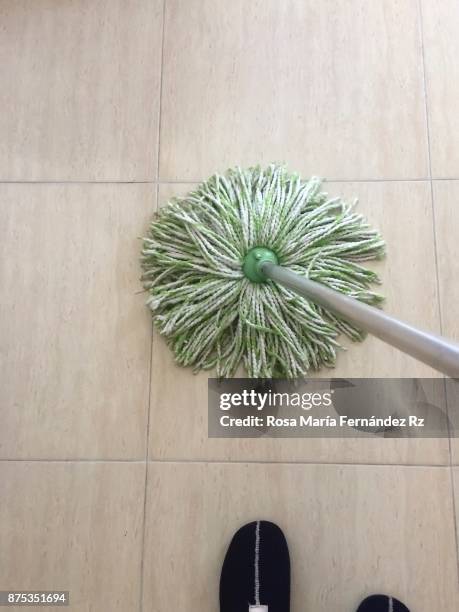 daily perspective: low section woman scrubbing the floor - mop stock pictures, royalty-free photos & images