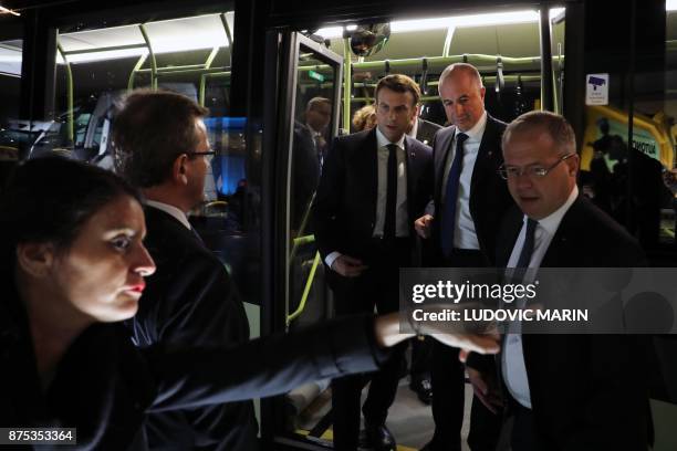 France's President Emmanuel Macron arrives with Volvo employees by bus to visit the Volvo Campus Lundby of the Swedish carmaker on the sidelines of...