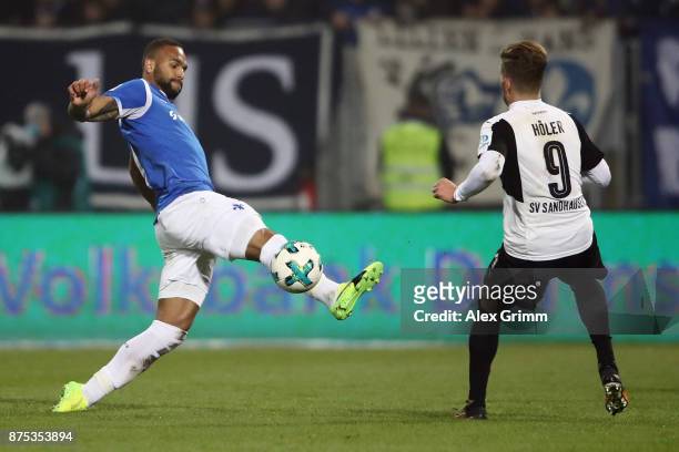 Terrence Boyd of Darmstadt is challenged by Lucas Hoeler of Sandhausen during the Second Bundesliga match between SV Darmstadt 98 and SV Sandhausen...