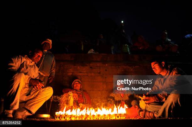 Nepalese devotees offering 108 butter lamps on the bank of Bagmati river on the occasion of Bala Chaturdashi festival celebrated in Kathmandu, Nepal...