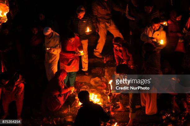 Nepalese devotees offering oil lamps on the bank of Bagmati river on the occasion of Bala Chaturdashi festival celebrated in Kathmandu, Nepal on...