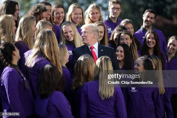 Members of the National Collegiate Athletic Association's champion University of Washington women's rowing team pose for photographs with U.S....