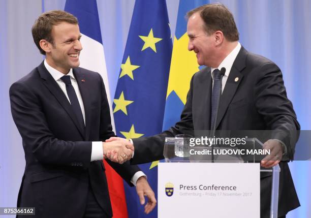 France's President Emmanuel Macron and Sweden's Prime Minister Stefan Lofven shake hands after a press conference during a visit to the Volvo Campus...