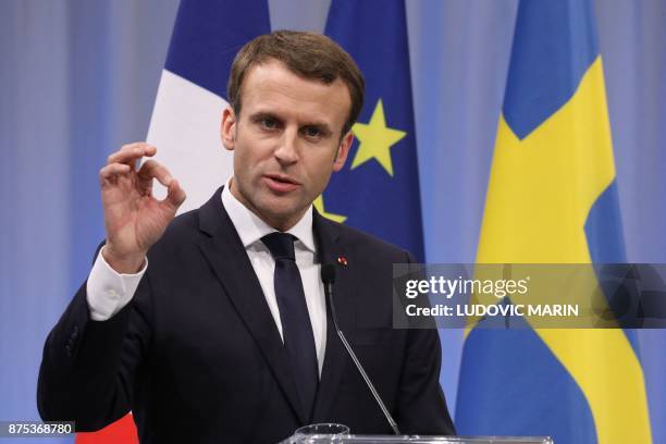 France's President Emmanuel Macron addresses a press conference at the Volvo Campus Lundby of the Swedish carmaker on the sidelines of the European...