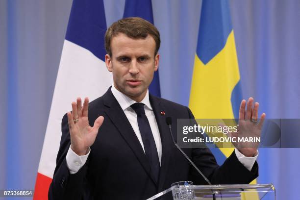 France's President Emmanuel Macron addresses a press conference at the Volvo Campus Lundby of the Swedish carmaker on the sidelines of the European...