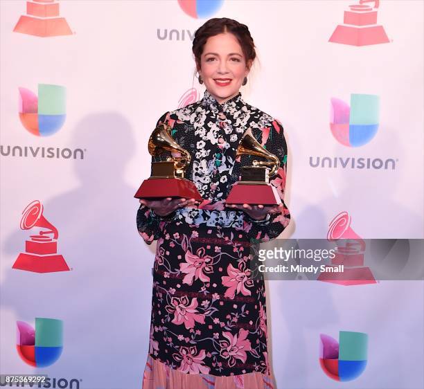 Natalia Lafourcade poses with awards for Best Folk Album and Best Long Form Music Video in the press room during The 18th Annual Latin Grammy Awards...