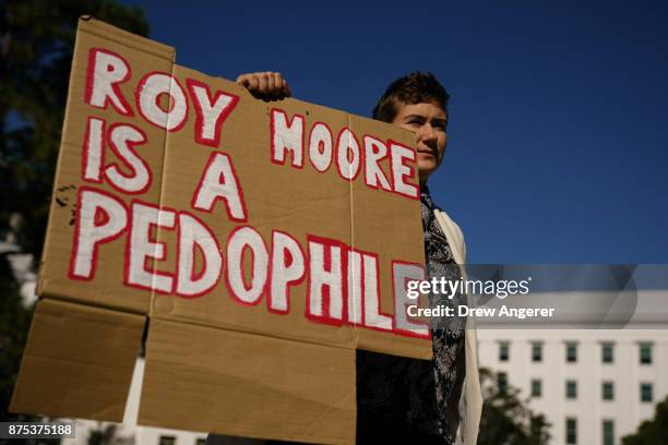 Rose Falvey protests across the street from a 'Women For Moore' rally in support of Republican candidate for U.S. Senate Judge Roy Moore, in front of...