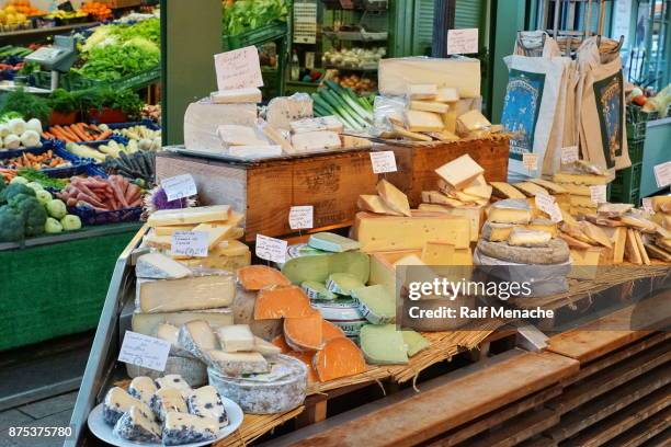 wide selection of chees at the viktualienmarkt. munich, bavaria. - viktualienmarkt stock pictures, royalty-free photos & images