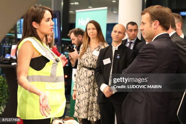 France's President Emmanuel Macron speaks with employees during a visit to the Volvo Campus Lundby of the Swedish carmaker on the sidelines of the...