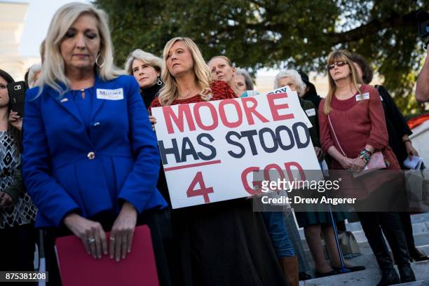 Women attend a 'Women For Moore' rally in support of Republican candidate for U.S. Senate Judge Roy Moore, in front of the Alabama State Capitol,...