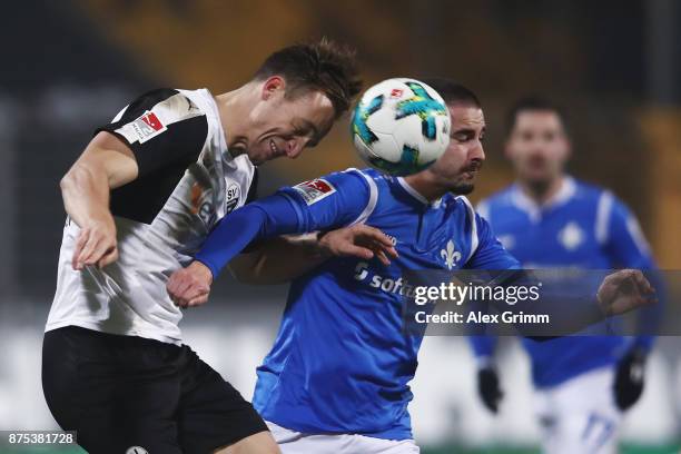 Jamie McLaren of Darmstadt is challenged by Tim Knipping of Sandhausen during the Second Bundesliga match between SV Darmstadt 98 and SV Sandhausen...