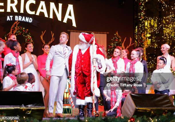 Derek Hough and performers onstage at Derek Hough Hosts The Americana at Brand Tree Lighting Presented By BMW on November 16 in Glendale, California...