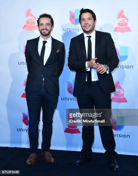 Mauricio Rengifo and Andres Torres pose with the award for Record of the Year in the press room during The 18th Annual Latin Grammy Awards at MGM...