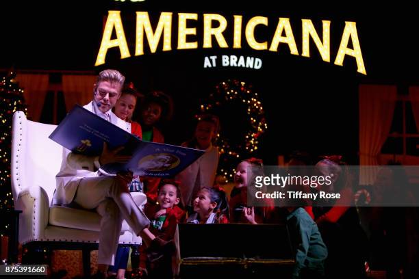 Derek Hough and performers onstage at Derek Hough Hosts The Americana at Brand Tree Lighting Presented By BMW on November 16 in Glendale, California...
