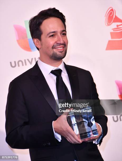 Lin-Manuel Miranda poses with the President's Merit Award in the press room during The 18th Annual Latin Grammy Awards at MGM Grand Garden Arena on...