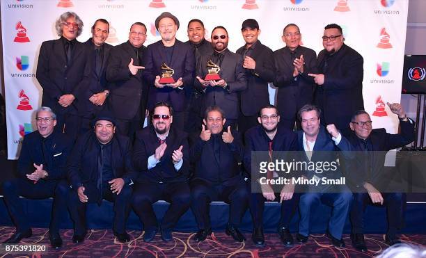 Ruben Blades and Roberto Delgado pose with awards for Album of the Year and Best Salsa Album in the press room during The 18th Annual Latin Grammy...
