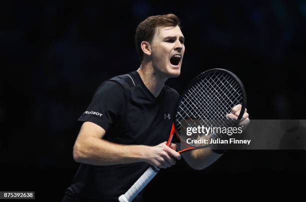 Jamie Murray of Great Britain celebrates partnering Bruno Soares of Brazil in the Doubles match against Lukasz Kubot of Poland and Marcelo Melo of...