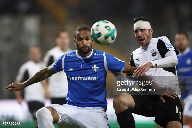 Terrence Boyd of Darmstadt is challenged by Tim Kister of Sandhausen during the Second Bundesliga match between SV Darmstadt 98 and SV Sandhausen at...