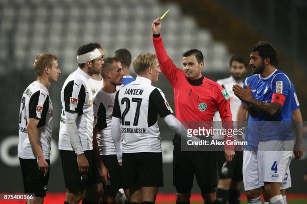 Referee Christian Dietz shows the yellow card to Max Jansen of Sandhausen during the Second Bundesliga match between SV Darmstadt 98 and SV...