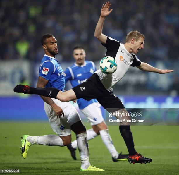 Philipp Klingmann of Sandhausen is challenged by Terrence Boyd of Darmstadt during the Second Bundesliga match between SV Darmstadt 98 and SV...