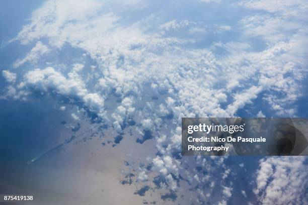 fluffy clouds - aerial cloudscape stock pictures, royalty-free photos & images