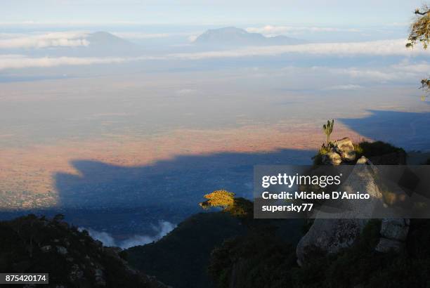 view over the wide red expanses of the masai steppe - mount meru stock pictures, royalty-free photos & images