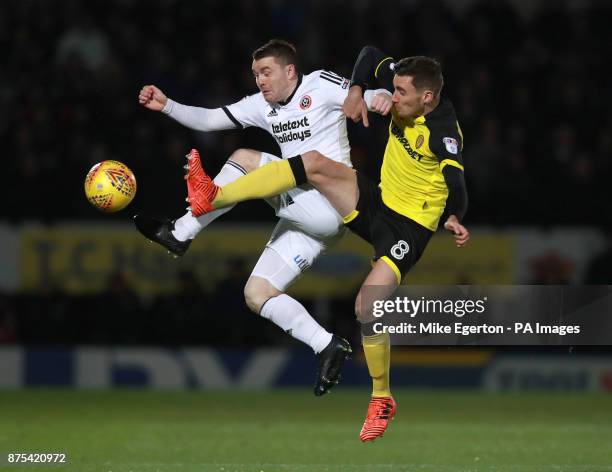 Sheffield United's John Fleck and Burton Albion's Matthew Lund during the Sky Bet Championship match at The Pirelli Stadium, Burton.