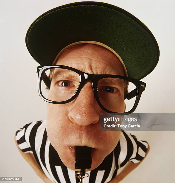 referee blowing whistle, close-up, elevated view (wide angle) - visselpipa bildbanksfoton och bilder