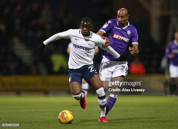 Stephy Mavididi of Preston North End holds off a challenge from Karl Henry of Bolton Wanderers during the Sky Bet Championship match between Preston...