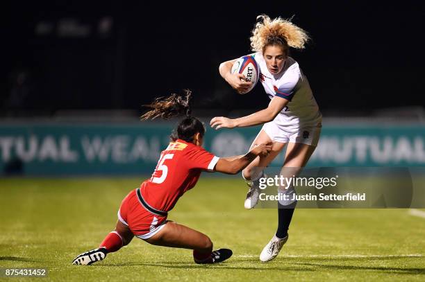 Abigail Dow of England is tacked by Anais Holly of Canada during the Old Mutual Wealth Series between England Women and Canada Women at Allianz Park...