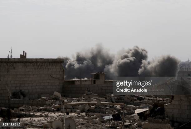 Smoke rises after Assad regime's warcrafts carry out intensifying airstrikes over residential areas of Arbin town of the Eastern Ghouta region of...