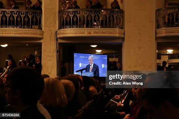 As he is seen on a TV monitor, U.S. Attorney General Jeff Sessions speaks during an event November 17, 2017 in Washington, DC. Sessions addressed The...