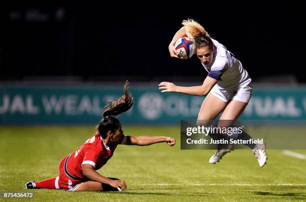 Abigail Dow of England is tacked by Anais Holly of Canada during the Old Mutual Wealth Series between England Women and Canada Women at Allianz Park...