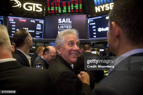 Mark McClain, chief executive officer and co-founder of Sailpoint Technologies Holdings Inc., center, smiles during the company's initial public...