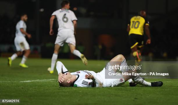 Sheffield United's Paul Coutts lies injured after a serious leg injury during the Sky Bet Championship match at The Pirelli Stadium, Burton.