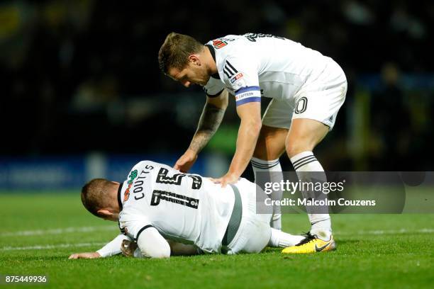 Billy Sharp of Sheffield United attends to teammate Paul Coutts during the Sky Bet Championship match between Burton Albion and Sheffield United at...