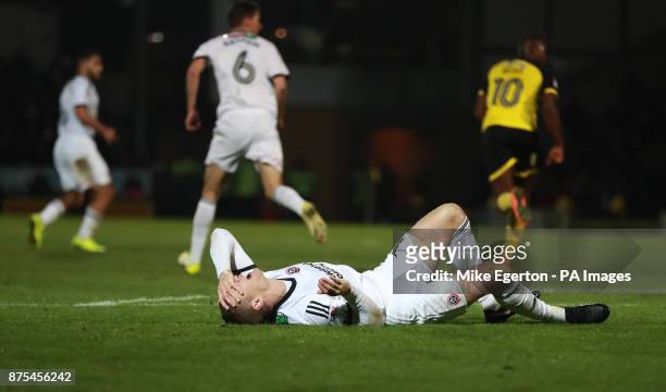 Sheffield United's Paul Coutts lies injured after a serious leg injury during the Sky Bet Championship match at The Pirelli Stadium, Burton.
