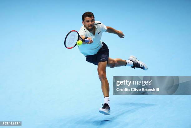 Grigor Dimitrov of Bulgaria plays a forehand in his Singles match against Pablo Carreno Busta of Spain during day six of the Nitto ATP World Tour...