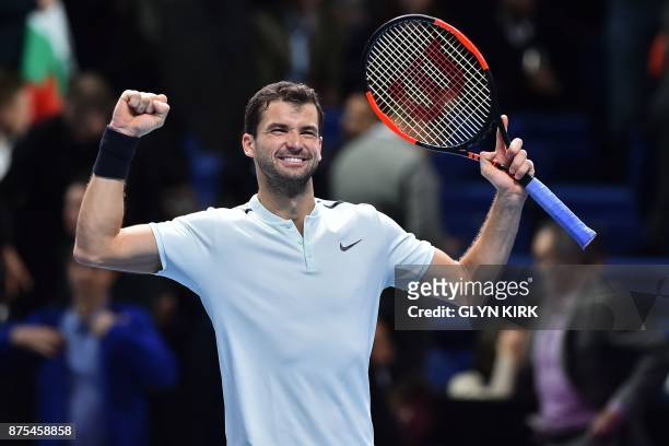 Bulgaria's Grigor Dimitrov reacts to winning his men's singles round-robin match against Spain's Pablo Carreno Busta in straight sets on day six of...