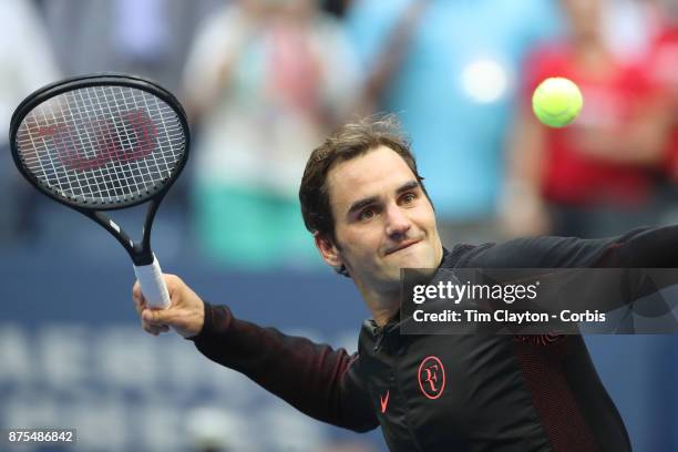 Open Tennis Tournament - DAY FOUR. Roger Federer of Switzerland hits balls into the crowd after his victory against Mikhail Youzhny of Russia during...