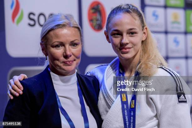 The family business: Daria Bilodid of Ukraine who was World Cadet champion at the age of 15 and Senior European champion at 16 hugs her mother and...