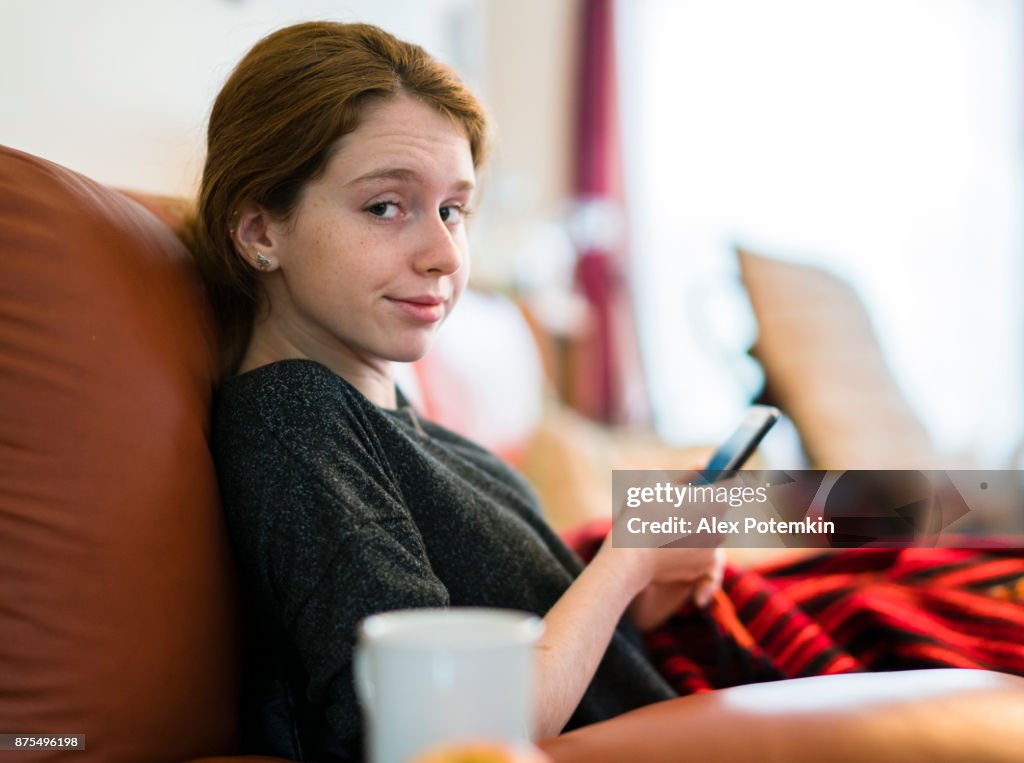 Pretty Caucasian teenager girl browsing social media
