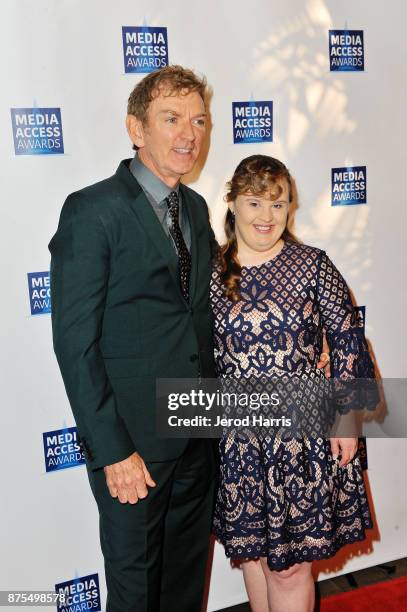 Michael Patrick King and Jamie Brewer attend the Media Access Awards 2017 at The Four Seasons on November 17, 2017 in Beverly Hills, California.