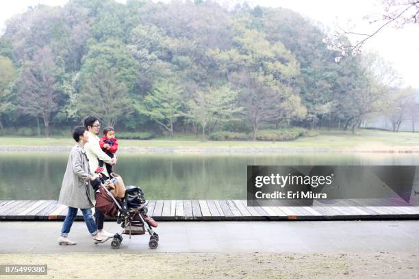 a family is walking in the park - father son water park stockfoto's en -beelden