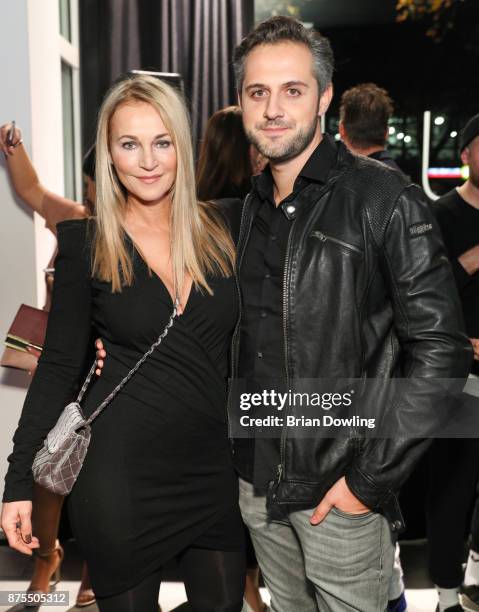 Caroline Beil and Philipp Sattler attend the Apjar Black studio opening on November 17, 2017 in Berlin, Germany.