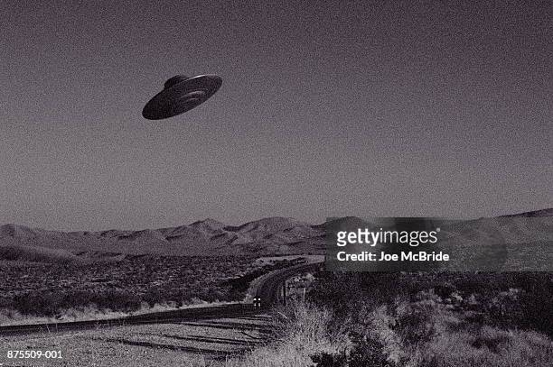 ufo over mojave desert, california, usa (b&w) - flying saucer stock pictures, royalty-free photos & images