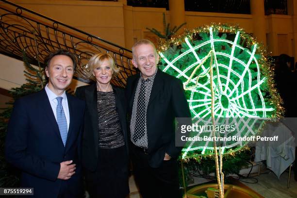 Stephane Bern, Marie-Christiane Marek and Jean-Paul Gaultier pose in front of Jean-Paul's Christmas Tree during the 22th Edition of "'Les Sapins de...
