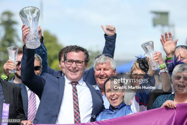 Jockey Sam Spratt with owner Matt Allnutt celebrate after their horse Hasahalo wins race 8 New Zealand 1000 Guineas during day three of the New...